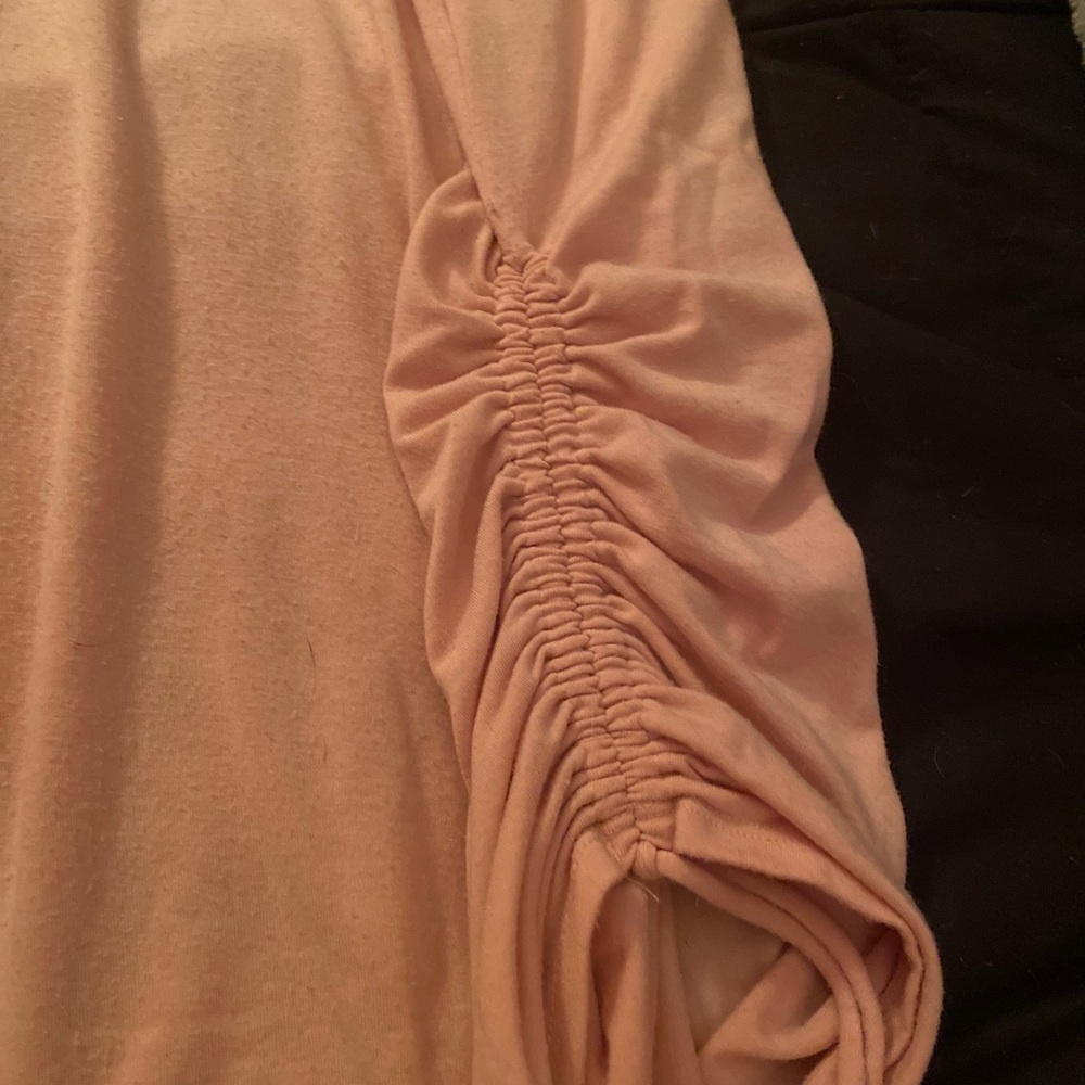 Pastel pink t shirt.